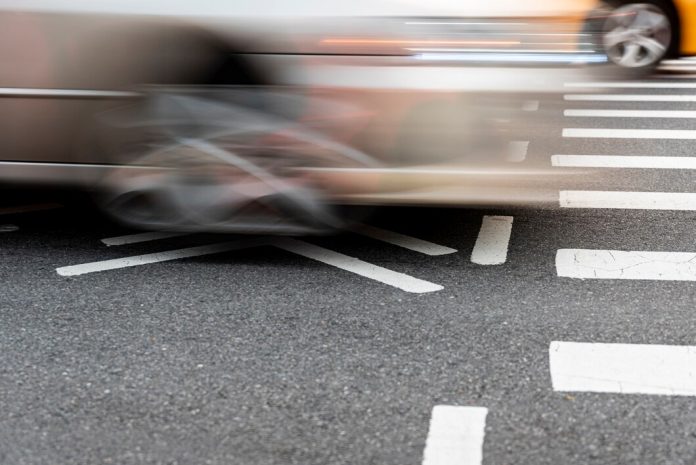 crossing-cars-road-closeup_23-2148242195